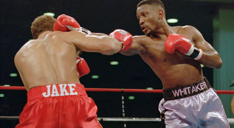 In this Nov. 18, 1995, file photo, WBC welterweight champion Pernell "Sweet Pea" Whitaker, right, delivers a right to the head of challenger Jake Rodriguez during their scheduled 12 round bout in Atlantic City, N.J. (AP Photo/Donna Connor, File)