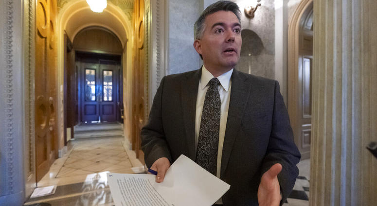 FILE - In this Dec. 31, 2018, file photo, Sen. Cory Gardner, R-Colo., arrives at the Senate Chamber for an abbreviated pro-forma session at the Capitol in Washington. The headquarters of the U.S. government's largest land agency will move from the nation'