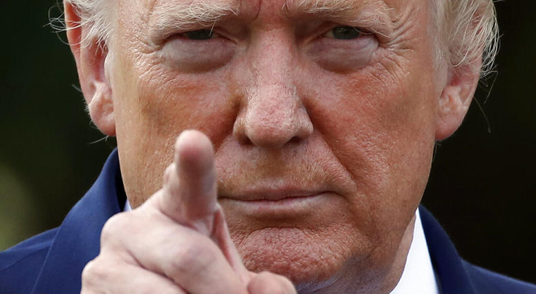 President Donald Trump points to a reporter for a questions as he speaks with reporters on the South Lawn of the White House before departing, Friday, July 19, 2019, in Washington. (AP Photo/Alex Brandon)