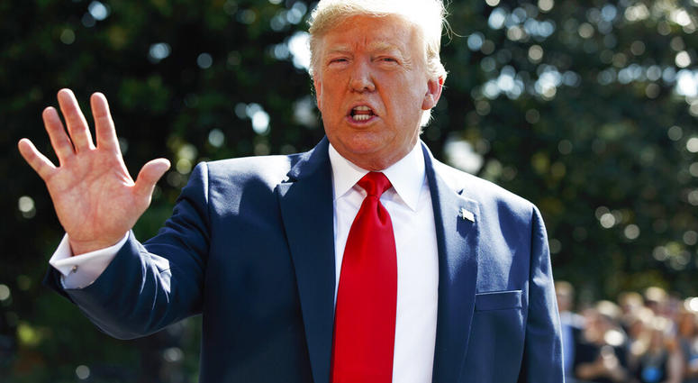 President Donald Trump talks to reporters on the South Lawn of the White House, Friday, Aug. 9, 2019, in Washington, as he prepares to leave Washington for his annual August holiday at his New Jersey golf club. (AP Photo/Evan Vucci)