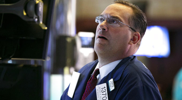 Specialist Anthony Matsic works at his post on the floor of the New York Stock Exchange, Monday, Aug. 12, 2019. (AP Photo/Richard Drew)