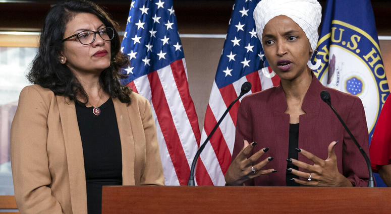 In this July 15, 2019, file photo, U.S. Rep. Ilhan Omar, D-Minn, right, speaks, as U.S. Rep. Rashida Tlaib, D-Mich. listens, during a news conference at the Capitol in Washington. (AP Photo/J. Scott Applewhite, File)