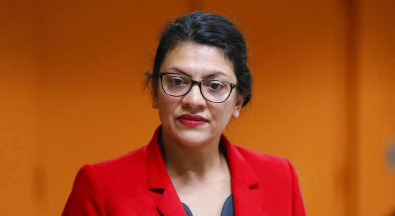 U.S. Rep. Rashida Tlaib, D-Mich., listens to a question from a constituent in Wixom, Mich., Thursday, Aug. 15, 2019. (AP Photo/Paul Sancya)