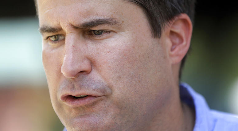 Democratic presidential candidate Rep. Seth Moulton, D-Mass., speaks with reporters, Sunday, Aug. 18, 2019, at the Hillsborough County Democrats Summer Picnic, in Greenfield, N.H. (AP Photo/Steven Senne)