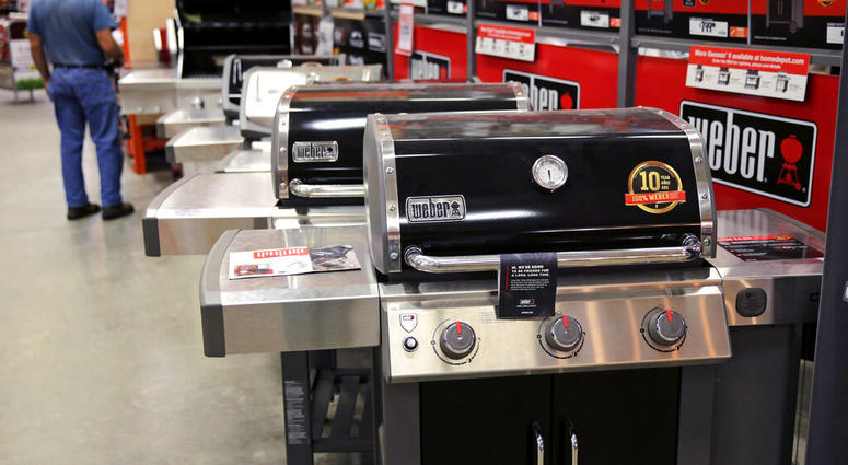 FILE - In this July 11, 2019, file photo Weber grills are displayed at the Home Depot store in Londonderry, N.H. The Home Depot Inc. on Tuesday, Aug. 20, reported fiscal second-quarter net income of $3.48 billion. (AP Photo/Charles Krupa, File)