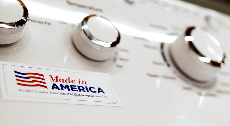 ILE - In this May 9, 2019, file photo a General Electric washing machine with a label advertising it was made in America is displayed in retail stores in Cranberry Township, Pa.