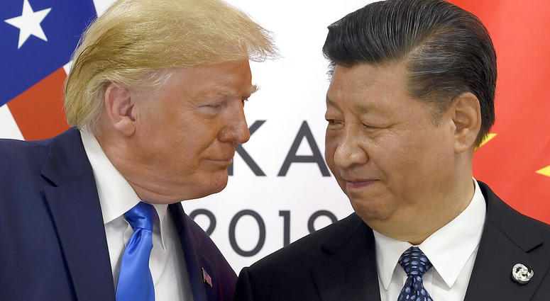 FILE - In this June 29, 2019, file photo, President Donald Trump, left, meets with Chinese President Xi Jinping during a meeting on the sidelines of the G-20 summit in Osaka, Japan.