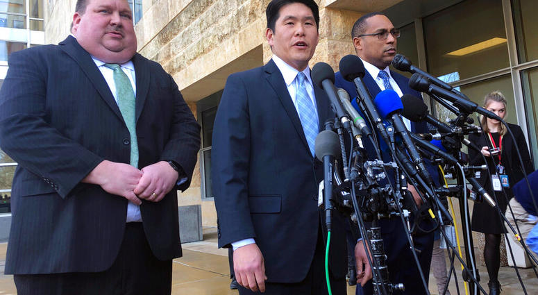 FILE - This Feb. 21, 2019, file photo shows U.S. Attorney Robert Hur, center, of the District of Maryland, speaks as Art Walker, left, special agent from the Coast Guard investigative service, and Gordon Johnson, special agent in charge of the FBI's Balti
