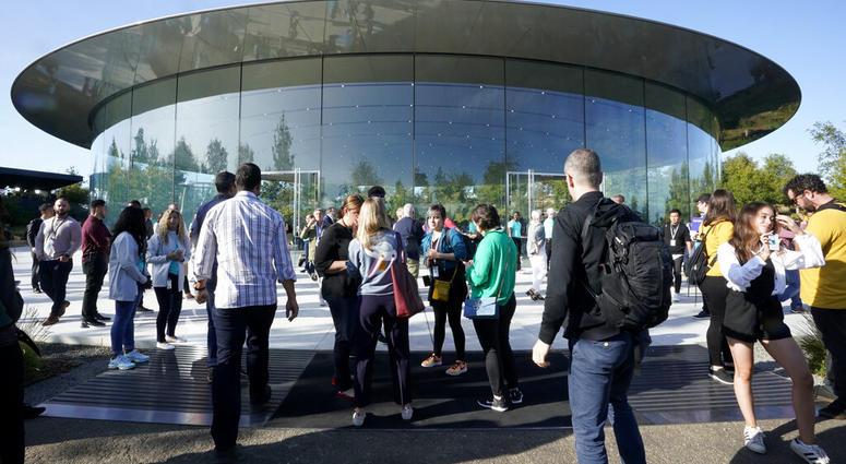 People arrive at Apple for an event to announce new products Tuesday, Sept. 10, 2019, in Cupertino, Calif.
