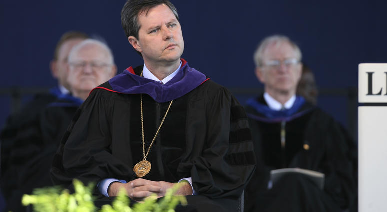 FILE - In this May 19, 2007, file photo, Jerry Falwell, Jr. listens before speaking for the first time as chancellor of Liberty University at the school's graduation ceremony in Lynchburg, Va.