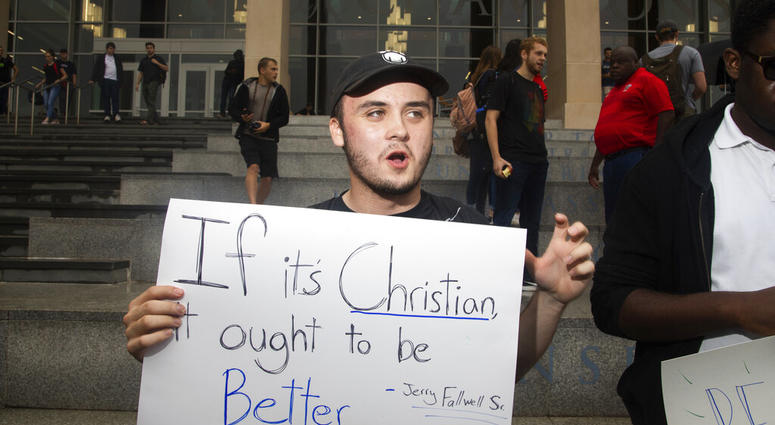 Junior Jonah Lackey converses with other students during a student protest on Friday, Sept. 13, 2019, at Liberty University in Lynchburg, Va. (Emily Elconin/The News & Advance via AP)
