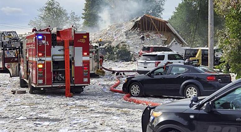 Emergency vehicles are at the scene of a deadly propane explosion, Monday, Sept. 16, 2019, which leveled new construction in Farmington, Maine.