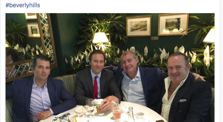 This Facebook screen shot provided by The Campaign Legal Center, shows from left, Donald Trump, Jr., Tommy Hicks, Jr., Lev Parnas and Igor Fruman, posted on May 21, 2018. (The Campaign Legal Center via AP)