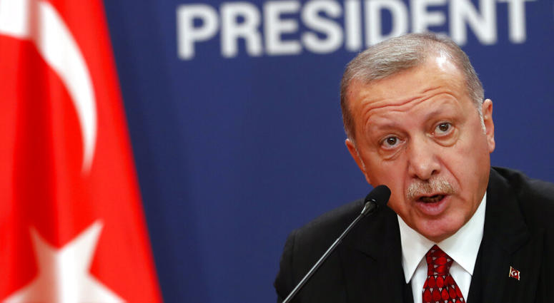 Turkey's President Recep Tayyip Erdogan speaks during a joint news conference after talks with his Serbian counterpart Aleksandar Vucic in Belgrade, Serbia, Monday, Oct. 7, 2019. (AP Photo/Darko Vojinovic)