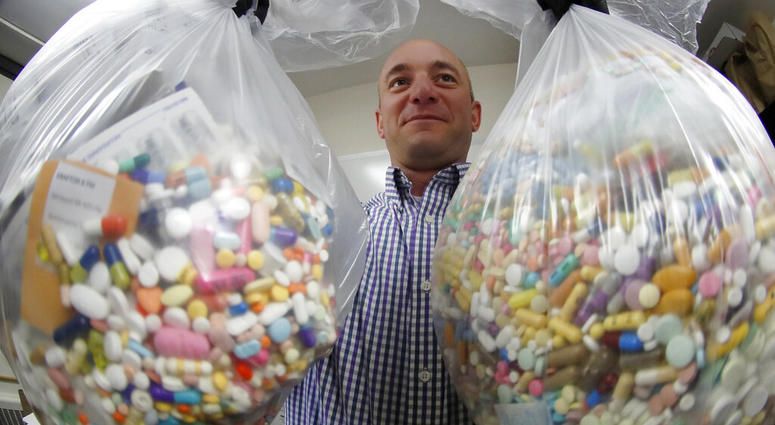 FILE - Narcotics detective Ben Hill, with the Barberton Police Department, shows two bags of medications that are are stored in their headquarters and slated for destruction in Barberton, Ohio. (AP Photo/Keith Srakocic, File) FILE - Narcotics detective Ben Hill, with the Barberton Police Department, shows two bags of medications that are are stored in their headquarters and slated for destruction in Barberton, Ohio. (AP Photo/Keith Srakocic, File)