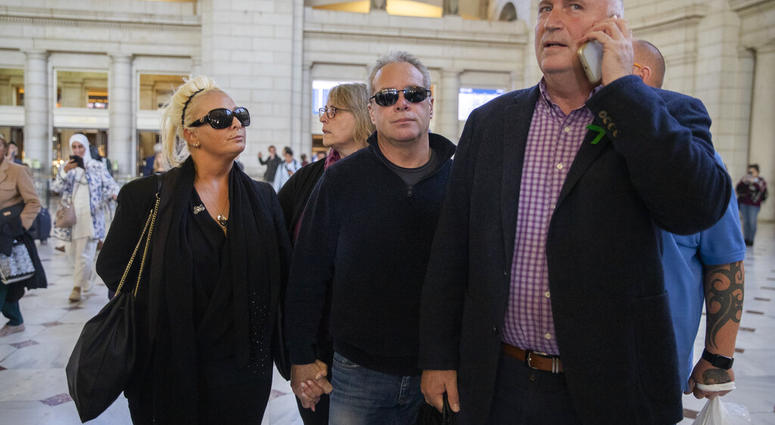 Charlotte Charles, left, mother of British teenager Harry Dunn, and her husband Bruce Charles, center arrive at Union Station in Washington, Tuesday, Oct. 15, 2019. (AP Photo/Manuel Balce Ceneta)