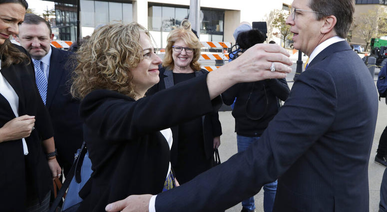 Attorneys Linda Singer and Mark Lanier hug outside the U.S. Federal courthouse, Monday, Oct. 21, 2019, in Cleveland. Both Singer and Lanier are the plaintiffs attorneys. (AP Photo/Tony Dejak) Attorneys Linda Singer and Mark Lanier hug outside the U.S. Federal courthouse, Monday, Oct. 21, 2019, in Cleveland. Both Singer and Lanier are the plaintiffs attorneys. (AP Photo/Tony Dejak)