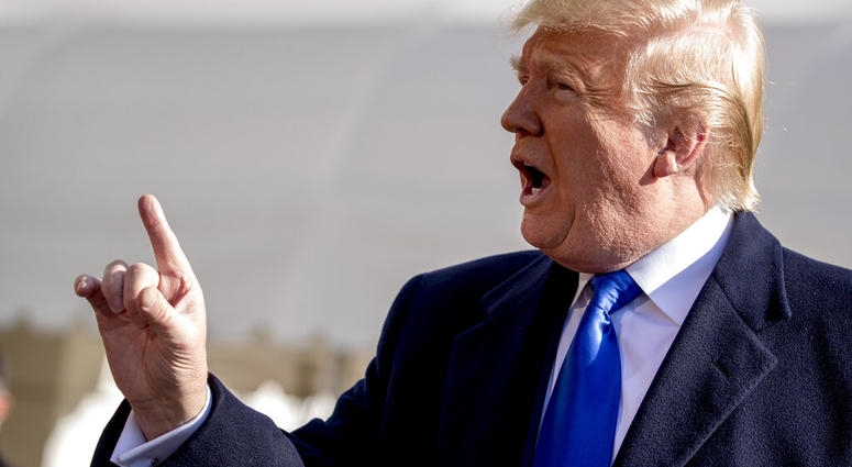 President Donald Trump tells a reporter to be quiet as he speaks on the South Lawn of the White House in Washington, Friday, Nov. 8, 2019, before boarding Marine One. (AP Photo/Andrew Harnik)
