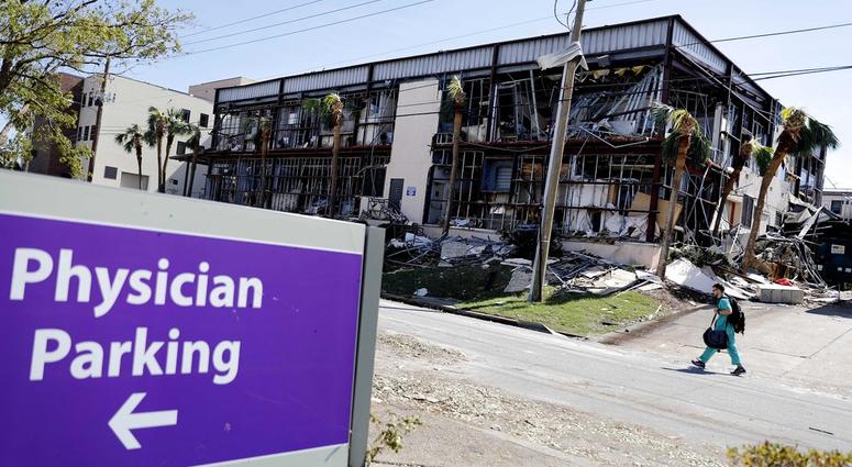 A building at the Bay Medical Center Sacred Heart hospital stands damaged from hurricane Michael in Panama City, Fla., Thursday, Oct. 11, 2018. The devastation inflicted by Hurricane Michael came into focus Thursday with rows upon rows of homes found smas
