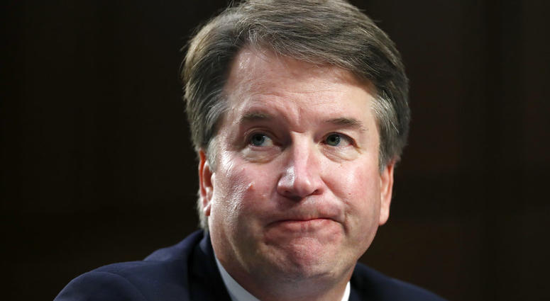 In this Sept. 6, 2018 photo, Supreme Court nominee Brett Kavanaugh reacts as he testifies after questioning before the Senate Judiciary Committee on Capitol Hill in Washington. Official Washington is scrambling Monday to assess and manage Kavanaugh’s pros