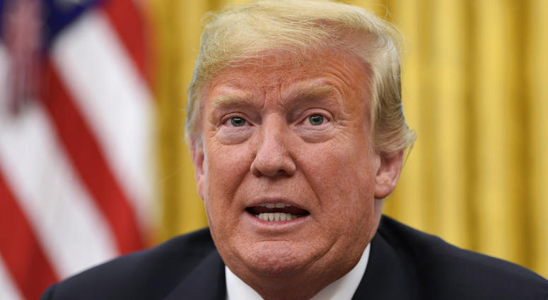 President Donald Trump talks about Hurricane Florence following a briefing in the Oval Office of the White House in Washington, Tuesday, Sept. 11, 2018. (AP Photo/Susan Walsh)