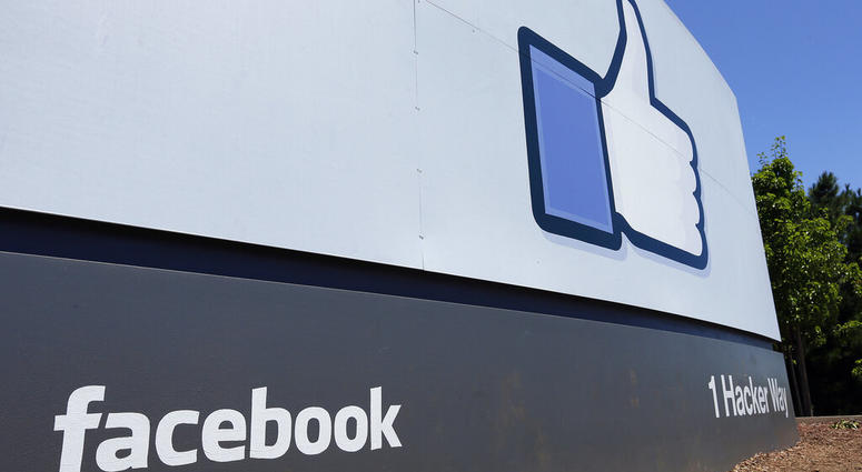 FILE - This July 16, 2013 file photo shows a sign at Facebook headquarters in Menlo Park, Calif. Facebook said in a Thursday, May 23, 2019 report, it removed more than 3 billion fake accounts. (AP Photo/Ben Margot, File)
