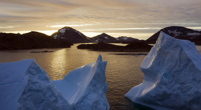 An aerial view of large Icebergs floating as the sun rises near Kulusuk, Greenland, early Aug. 16, 2019. Greenland has been melting faster in the last decade and this summer, it has seen two of the biggest melts on record since 2012. (AP Photo/Felipe Dana