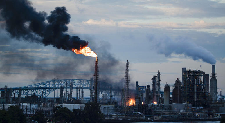 (AP Photo/Matt Rourke) Flames and smoke emerge from the Philadelphia Energy Solutions Refining Complex in Philadelphia, Friday, June 21, 2019. (AP Photo/Matt Rourke)