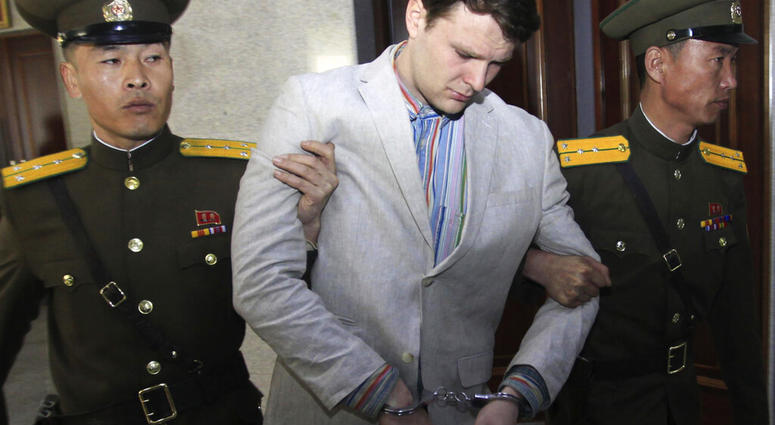 FILE - In this March 16, 2016, file photo, American student Otto Warmbier, center, is escorted at the Supreme Court in Pyongyang, North Korea. North Korea reportedly insisted the U.S. pay $2 million in medical costs in 2017 before it released Warmbier wh