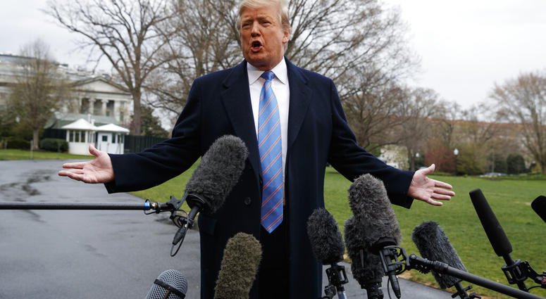 President Donald Trump speaks with reporters before boarding Marine One on the South Lawn of the White House, Friday, April 5, 2019, in Washington. (AP Photo/Evan Vucci)