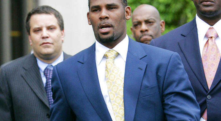 FILE - In this June 13, 2008 file photo, R&B singer R. Kelly leaves the Cook County Criminal Court Building in Chicago. (AP Photo/Nam Y. Huh, File)