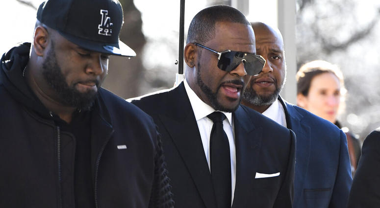 R. Kelly, right, arrives at the Leighton Criminal Court for a hearing on Friday, March 22, 2019, in Chicago. (AP Photo/Matt Marton)