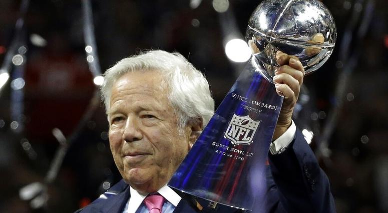 FILE - In this Feb. 3, 2019, file photo, New England Patriots owner Robert Kraft holds the Vince Lombardi trophy after the NFL Super Bowl 53 football game. (AP Photo/Mark Humphrey, File)