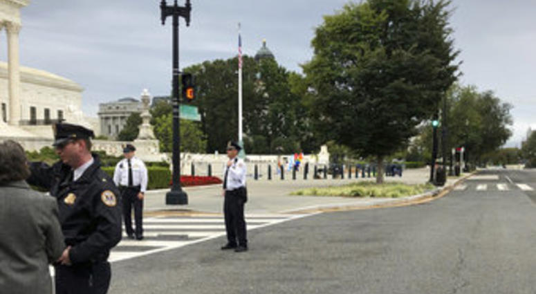 The streets outside the front of the Supreme Court are closed off for a suspicious package, Tuesday morning, Oct. 8, 2019 in Washington. (AP Photo/Mark Sherman)