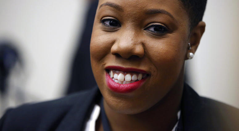 FILE - In this Jan. 11, 2016 file photo, Symone Sanders speaks to members of the media. Joe Biden has hired the prominent African American political strategist as a senior adviser to his newly launched presidential campaign. (AP Photo/Andrew Harnik)