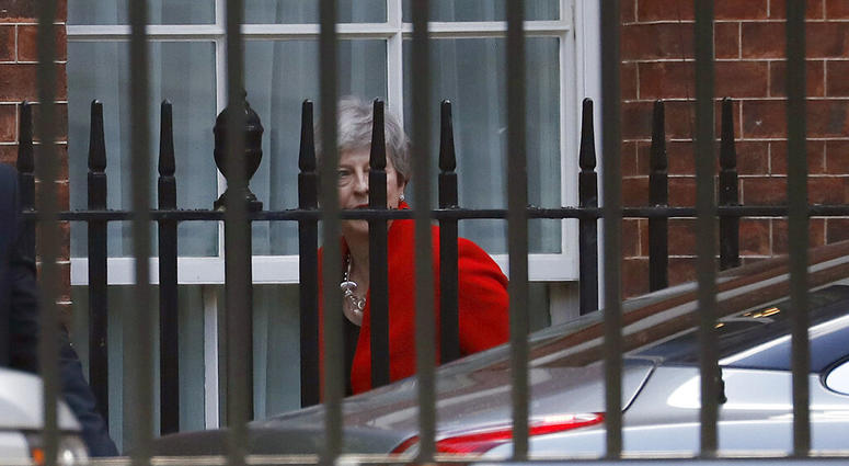 Britain's Prime Minister Theresa May leaves Downing Street in London, Friday, May 24, 2019. May announced Friday that she will step down as U.K. Conservative Party leader on June 7. (AP Photo/Frank Augstein)