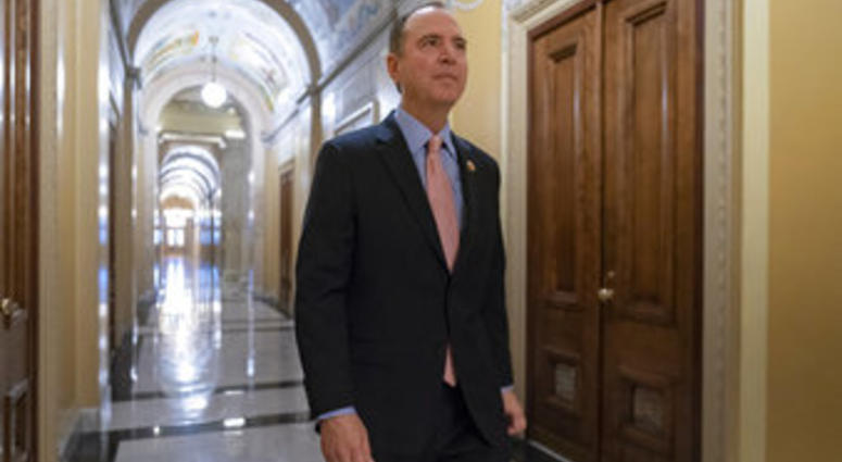 Rep. Adam Schiff, chairman of the House Intelligence Committee, walks to a secure area at the Capitol to interview a witness in the House impeachment inquiry. (AP Photo/J. Scott Applewhite)