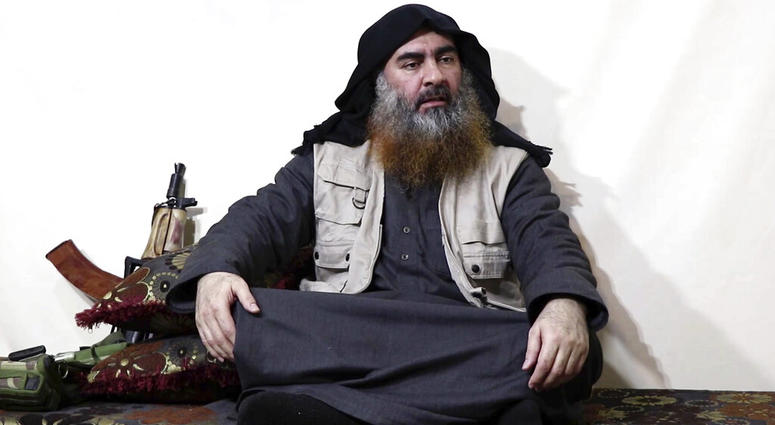 FILE - This file image made from video posted on a militant website April 29, 2019, purports to show the leader of the Islamic State group, Abu Bakr al-Baghdadi being interviewed by his group's Al-Furqan media outlet. (Al-Furqan media via AP, File)