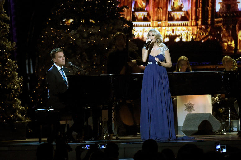 Pregnant Carrie Underwood and Michael W. Smith perform at the 2014 CMA Country Christmas concert in Nashville Pregnant Carrie Underwood and Michael W. Smith perform at the 2014 CMA Country Christmas concert in Nashville