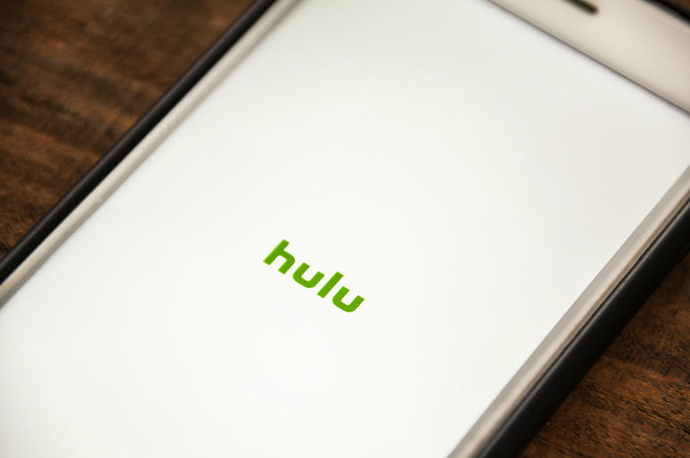 Vignette Selective Focus Apple iPhone 6+ with Hulu application showing on screen. Hulu is a streaming video app. Vignette Selective Focus Apple iPhone 6+ with Hulu application showing on screen. Hulu is a streaming video app.