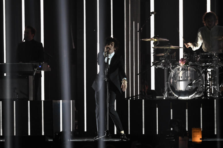 Matthew Healy performs with The 1975 on stage at The BRIT Awards 2017 Matthew Healy performs with The 1975 on stage at The BRIT Awards 2017