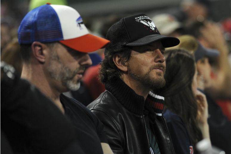 American musician, singer and songwriter Eddie Vedder watches the game between the Boston Red Sox and Chicago Cubs during the fourth inning at Fenway Park American musician, singer and songwriter Eddie Vedder watches the game between the Boston Red Sox and Chicago Cubs during the fourth inning at Fenway Park