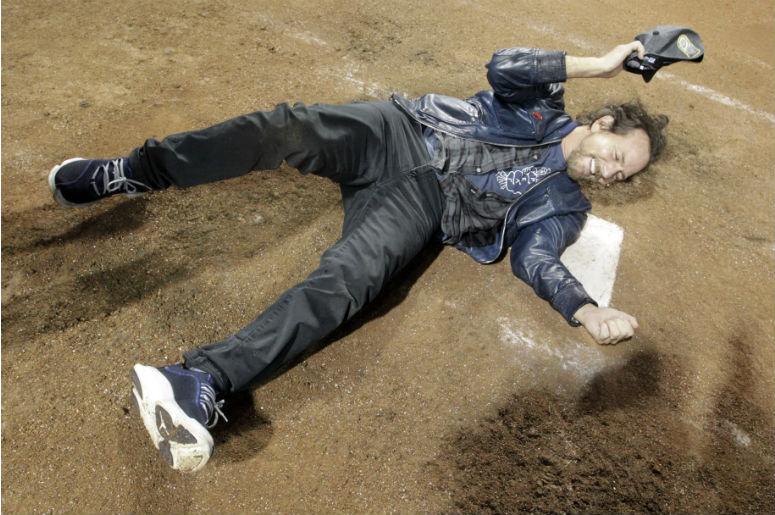 Recording artist Eddie Vedder celebrates on home plate after the Chicago Cubs defeated the Cleveland Indians in game seven of the 2016 World Series at Progressive Field Recording artist Eddie Vedder celebrates on home plate after the Chicago Cubs defeated the Cleveland Indians in game seven of the 2016 World Series at Progressive Field