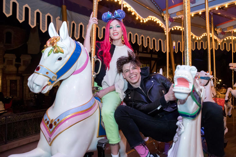 Singer Halsey and musician Yungblud ride on King Arthur Carrousel at Disneyland Park on February 22, 2019 in Anaheim, California Singer Halsey and musician Yungblud ride on King Arthur Carrousel at Disneyland Park on February 22, 2019 in Anaheim, California