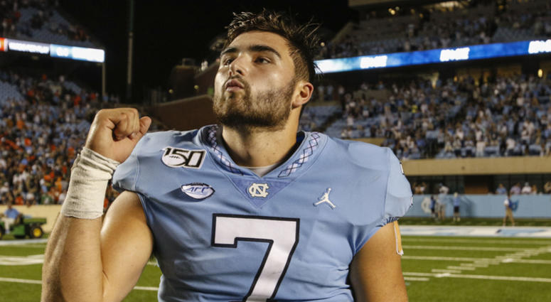 North Carolina Tar Heels quarterback Sam Howell (7) celebrates after leading the North Carolina Tar Heels to a 28-25 win over the Miami Hurricanes at Kenan Memorial Stadium. North Carolina Tar Heels quarterback Sam Howell (7) celebrates after leading the North Carolina Tar Heels to a 28-25 win over the Miami Hurricanes at Kenan Memorial Stadium.