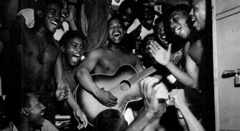 August 14, 1945 Enlisted men aboard the U.S.S. Ticonderoga (CV-14) hear the news of Japan's surrender