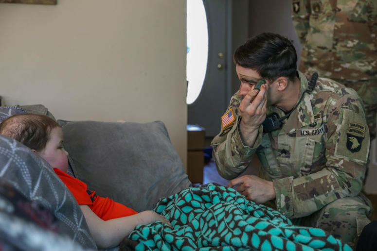 Instructor for Pre-Ranger Course gives Braxton Fuqua a quick tutorial on how to apply camouflage paint. Army soldiers help Make-A-Wish kid Braxton Fuqua dream come true.