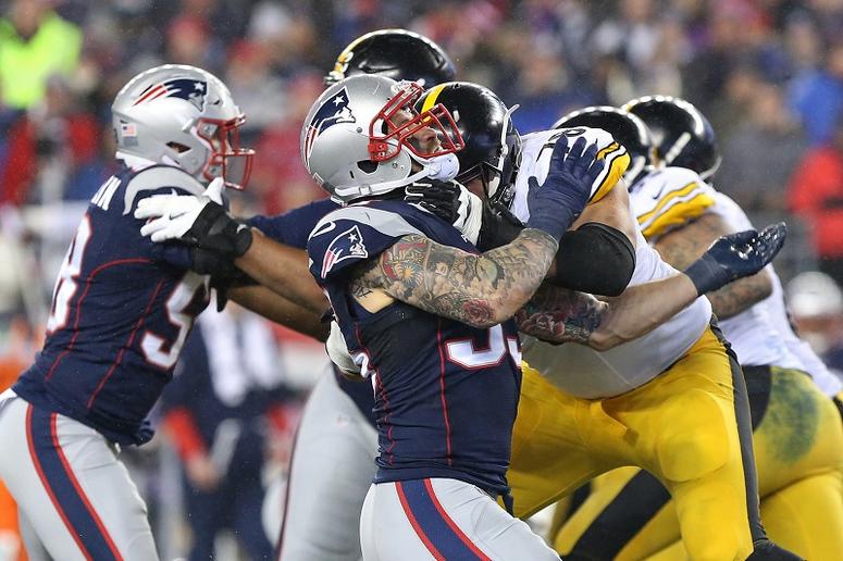 New England Patriots defensive end Chris Long (95) rushes as Pittsburgh Steelers offensive tackle Alejandro Villanueva (78) blocks in the 2017 AFC Championship Game at Gillette Stadium.