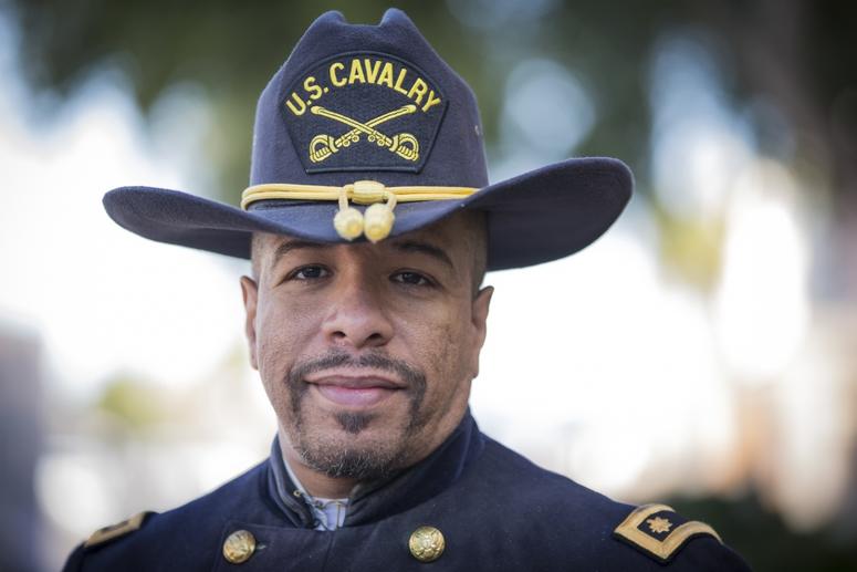 A civilian with the Buffalo Soldiers of the Arizona Territory and Ladies and Gentlemen of the Regiment pose for a portrait photo during Yuma Military Appreciation Day in Downtown Historic Yuma on Feb. 16, 2019. BuffaloSoldiers2