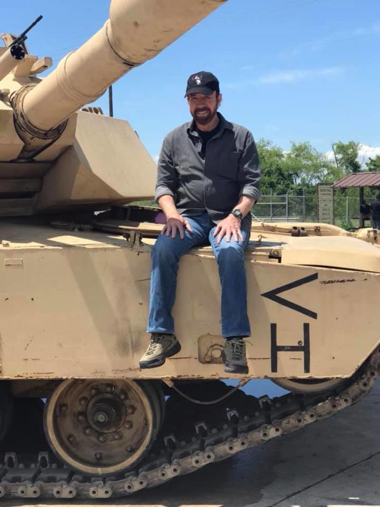 Chuck Norris gets up close and personal with an Abrams tank on Fort Bragg on May 14, 2019 for a documentary he's hosting. ChuckNorrisTank1